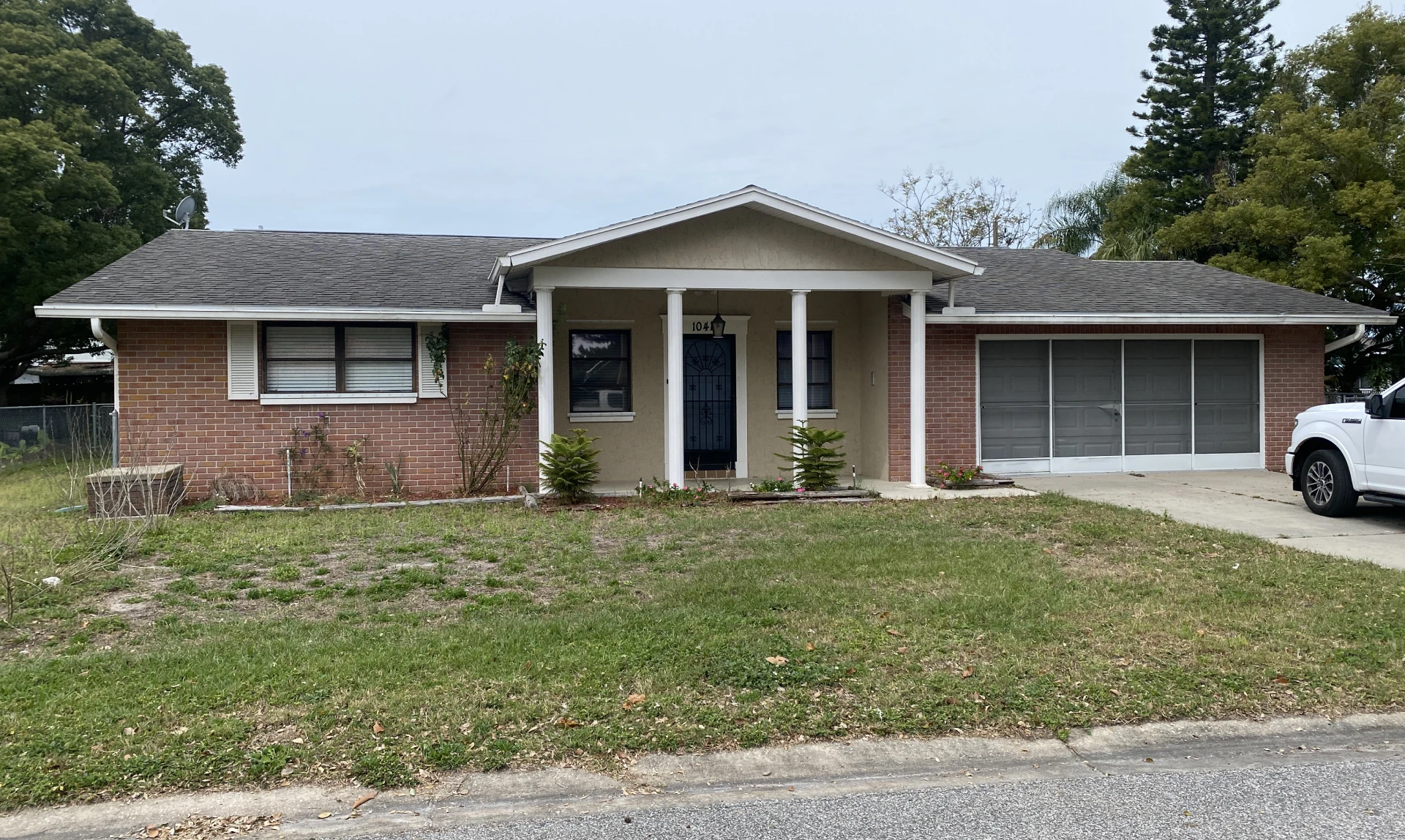 Brick house with garage and lawn